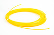 Top view of yellow rolled filament plastic for 3D Printing Pen isolated on white.