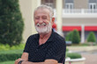 © Pruksachat - Caucasian Senior man with beard mustache smile and standing looking at camera