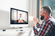 © GENETTICA - Young man talking to his doctor through a video conference