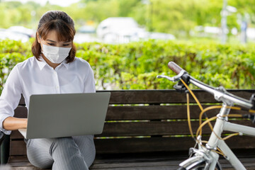 Poster - Asian businesswoman work in park