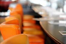 American Diner Lunch Counter With Orange Vinyl Seats. Shallow Depth Of Field.