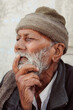 Portrait of an old Indian man lost in deep thoughts