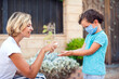 © Aleksej - Mother and kid with medical mask disinfecting hands with sanitizer outdoors. Life during coronavirus pandemic.