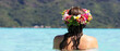 © Mat Hayward - Beautiful woman wearing colorful flower crown while on a tropical island vacation in Bora Bora near Tahiti in French Polynesia