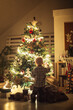 © Lumina/Stocksy - Boy by the Christmas Tree
