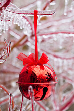 Red Christmas Ornament On Icy Branch
