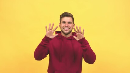 Wall Mural - Young caucasian handsome man showing number ten, symbol of counting, concept of mathematics, confident and cheerful