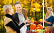 © Sean Locke Photography/Stocksy - Farmer's Market: Couple Laughing While Choosing Produce