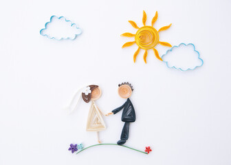 The romantic bridal couple. Hand made of paper quilling technique. Love, wedding concept.