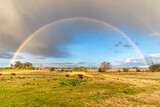 Fototapeta Tęcza - The rainbow in the field after the rain, Uruguay