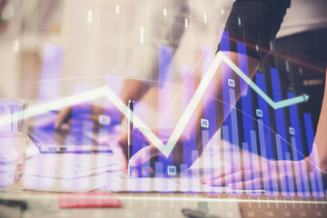 Multi exposure of woman hands typing on computer and financial chart hologram drawing. Stock market analysis concept.