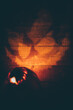 © Andrey Pavlov/Stocksy - Halloween pumpkin reflection