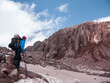© Martin Matej/Stocksy - Hiker looking at rocky ridge