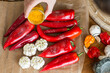 © Lior + Lone/Stocksy - Hand sprinkling turmeric on peppers and garlic