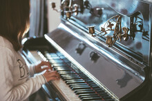 Closeup Of Woman Playing The Antique Piano.