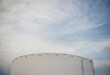 © Cara Dolan/Stocksy - Industrial oil fuel storage tanks