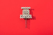 A Pin Shaped With Lot Of Screws On Red Background. Social Media Icon.