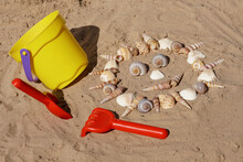 A Funny Seashell-sun With Sand Toys
