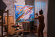 © DC Studio - Artist using phone to take a photo of her masterpiece painting in art workshop. Modern artwork paint on canvas, creative, contemporary and successful fine art artist drawing masterpiece