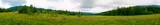 Fototapeta Krajobraz - Wonderful panorama of the mountains. Horses on a mountain meadow. Summer panorama landscape in the mountains. Ukraine, Carpathians. Beautiful nature villages. Picture of wildlife