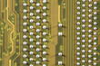 © Wenhai Tang/Stocksy - close-up of electronic circuit golden board background of computer motherboard.