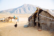 © AlejandroMCB photo & film/Stocksy - Hay hut in desertic rural village in Rajasthan, India.