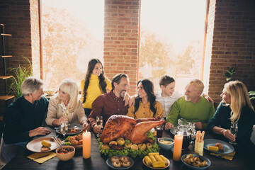 Poster - Portrait of nice attractive cheerful family brother sister siblings sitting around table embracing enjoying homemade turkey dish reunion at modern loft industrial brick interior house indoors