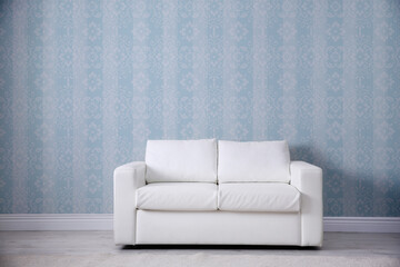 Sticker - Modern sofa near patterned wallpapers. Interior design