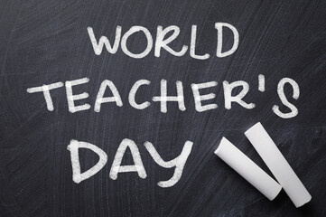 Canvas Print - Text World Teacher's Day and chalk on blackboard, top view. Greeting card design