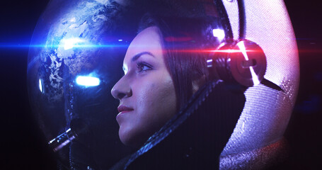Wall Mural - portrait shot of the young smiling female astronaut in space helmet. she is exploring outer space in