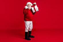 Hush No Say Tell X-mas Present. Full Length Photo Retired Pensioner Man Santa Claus Headwear Prepare Big Gift Box Put Finger Lips Wear Jumper Pants Boots Isolated Bright Shine Color Background