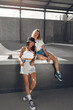 © puhhha - Skater Girls At Skatepark. Portrait Of Female Teenagers In Casual Outfit With Skateboard Against Concrete Ramp. Hipsters Posing At Outdoor. Urban Subculture Style And Summer Sport As Lifestyle.