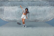 © puhhha - Skateboarding. Asian Girl In Urban Outfit With Skateboard Against Concrete Wall At Skatepark Portrait. City Sport As Hobby Of Active Teens. Skater Subculture And Summer Activity As Lifestyle.