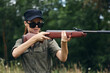 © SHOTPRIME STUDIO - Woman soldier Weapon in hand hunting sunglasses black cap