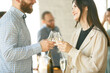 © master1305 - Happiness. People clinking glasses with wine or champagne. Happy cheerful friends celebrate holidays, meeting. Close up shot of smiling friends, lifestyle. Party at home or in restaurant, cafe.