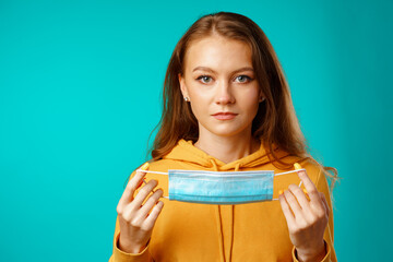 Young beautiful casual woman wearing protective medical mask