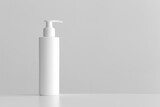 Fototapeta  - White cosmetic shampoo dispenser bottle mockup with blank copy space on a white table.
