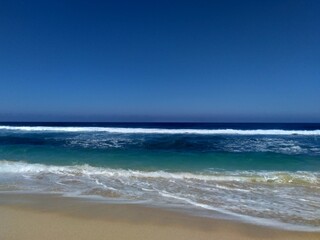 Beautiful scenery of blue beach. Tambakrejo beach, the one of beautiful indonesian beach in Blitar, East Java, Indonesia.