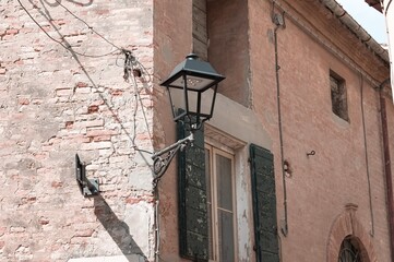 Wall Mural - Isolated street lantern on a brick wall of an old house (Pesaro, Italy, Europe)