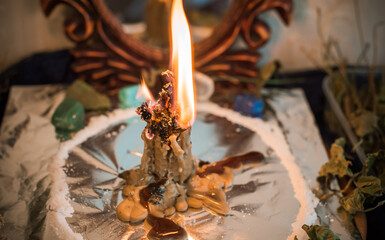 Candle for cleansing a person, magic rituals and wax casting, energy cleansing. Altar of modern witch.