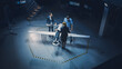 © Gorodenkoff - Team of Industrial Aerospace Engineers Work On Unmanned Aerial Vehicle Concept. Designers Work on Pilotless Drone. Industrial Facility with Aircraft Capable of Surveillance and Military. Elevated Shot