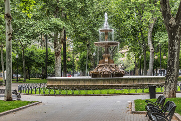 19th century Cordoba Gardens of la Merced (Jardines de la Merced), also known as Colon (Columbus) Gardens with a fountain near old convent of the friars of La Merced. Cordoba, Spain.