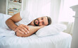 © My Ocean studio - Close up photo of handsome young bearded man lying in bed and relaxing on the morning