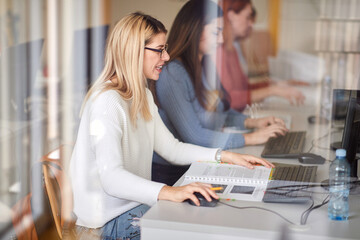 Wall Mural - Group of girls working on computers