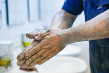 The Mechanic Washes His Dirty Hands After A Working Day