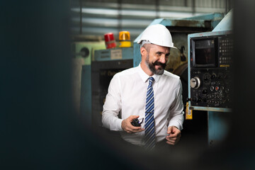 Wall Mural - Angry engineer construction worker because machines have frequent problems. Professional engineering working in Heavy Industry Manufacturing Facility.