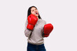 © PK Studio - Asian woman wearing boxer gloves on White background