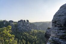 Stunning Shot Of Rock Formations Covered With Greenery In The Basteigebiet, Lohmen, Germany