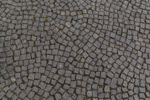 Old Granite Cobblestones Close Up Lined With An Arc