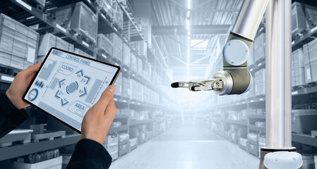 Aufkleber - Warehouse manager with digital tablet controls robot arm